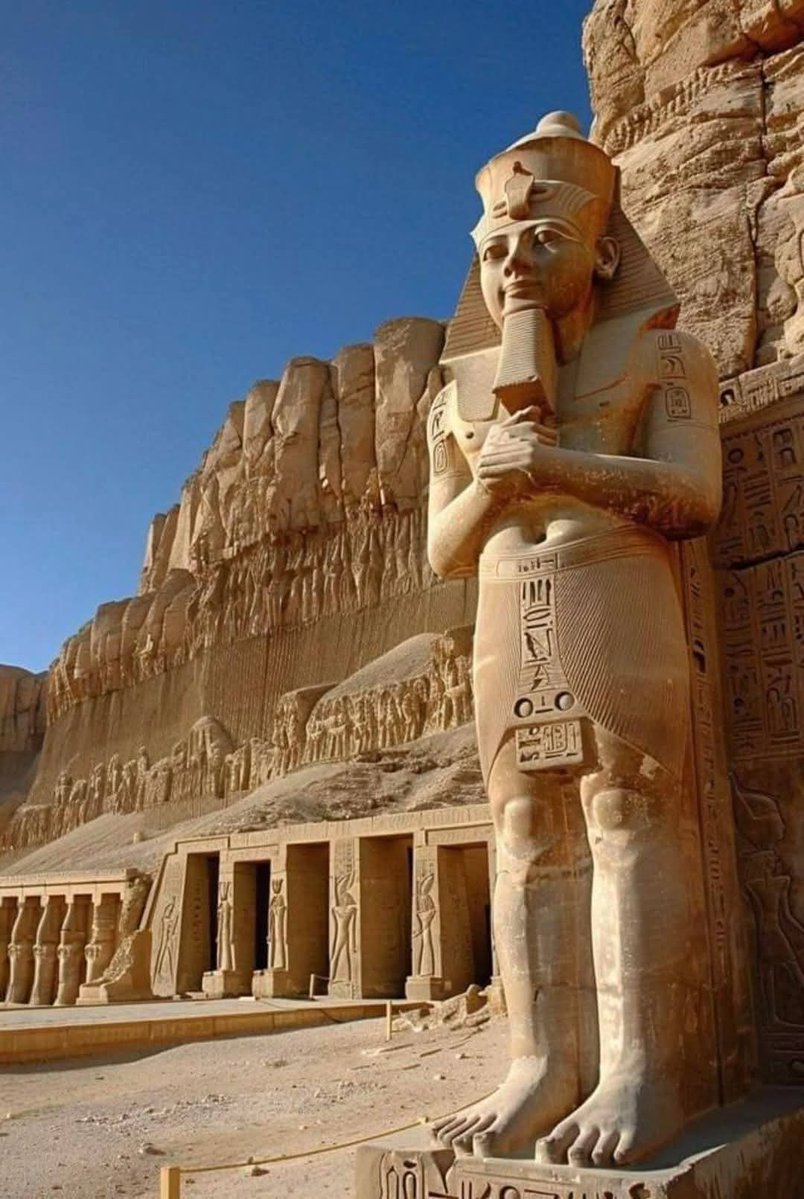 Carved directly into the sandstone cliffs of southern Egypt, this colossal seated statue stands at the Great Temple of Abu Simbel, near the modern border with Sudan. The monument dates to the reign of Pharaoh Ramesses II in the 13th century BCE (c. 1279–1213 BCE), during the height of the New Kingdom. Sculpted from living rock, the figure depicts the king in divine stillness, wearing the royal nemes headdress and false beard, his hands resting calmly upon his knees.
Behind and around him, walls of carved reliefs and hieroglyphic inscriptions proclaim military victories, royal lineage, and devotion to the gods. The sheer scale of the statue, towering above human visitors, was designed to project eternal power and divine authority. Standing before it today evokes a profound sense of awe—an encounter with ambition carved into stone, where time feels suspended between the ancient sun and the present sky.