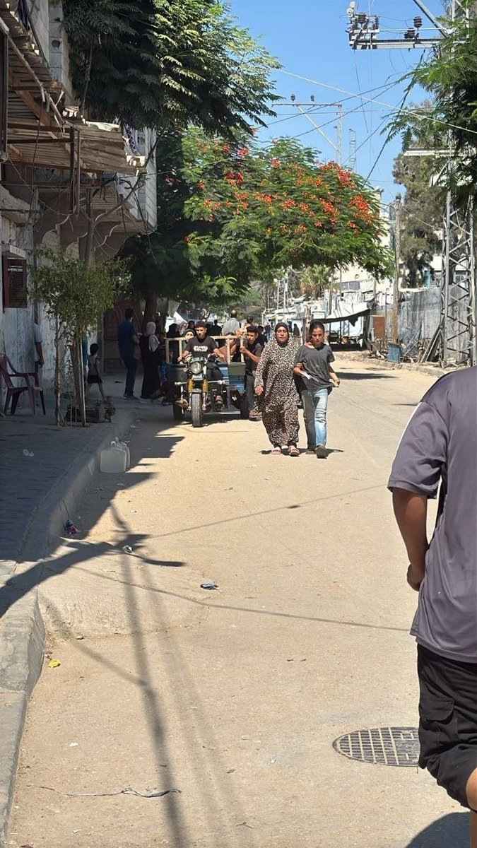 QudsNen's tweet photo. Breaking | Palestinians are evacuating an entire residential block in the Al-Bureij refugee camp, central Gaza, following Israeli military threats to bomb the area. https://t.co/Hv9vRkw8hb