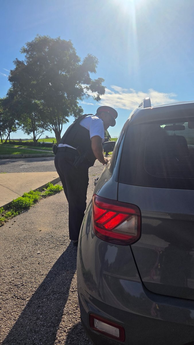 DRPS's tweet photo. Chief Moreira stopped a driver going 20km/hour over the limit in front of a school in Whitby. He spent some time providing education about fines being doubled in community safety zones. Please slow down. https://t.co/RCfCZcslog