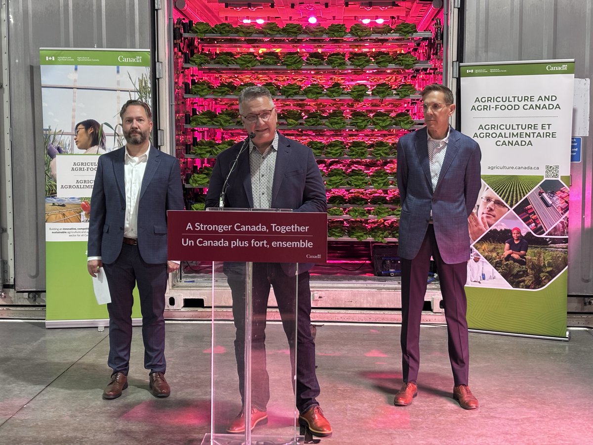 Minister MacDonald speaks at a podium.