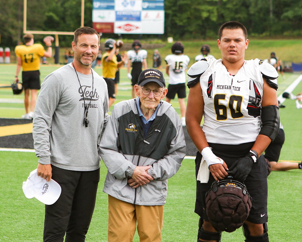 MTUFB's tweet photo. Former Michigan Tech football head coach Bill Lucier came to practice today to meet with Dan Mettlach and this year's Lucier Endowed Football Scholarship recipient, Adrian Gonzalez.

#CRTD | #FollowTheHuskies https://t.co/UMOyzZMjth