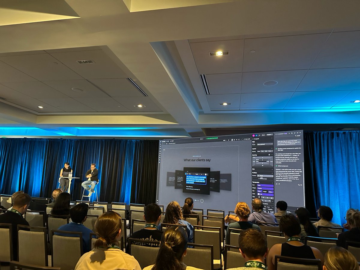 Webflow Conf photo showing AI-assisted visual editing of code components on a live canvas, illustrating a move from chat-only prompting toward higher-level interface control