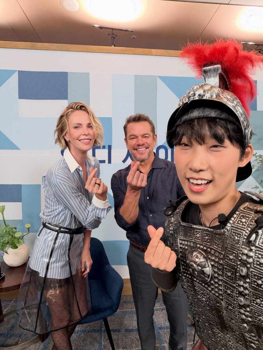 CTAOPF's tweet photo. Charlize Theron and Matt Damon participated in the MMTG Show during the promotion of The Odyssey in South Korea, alongside host Jae Jae.. https://t.co/6X9QfiiSLa