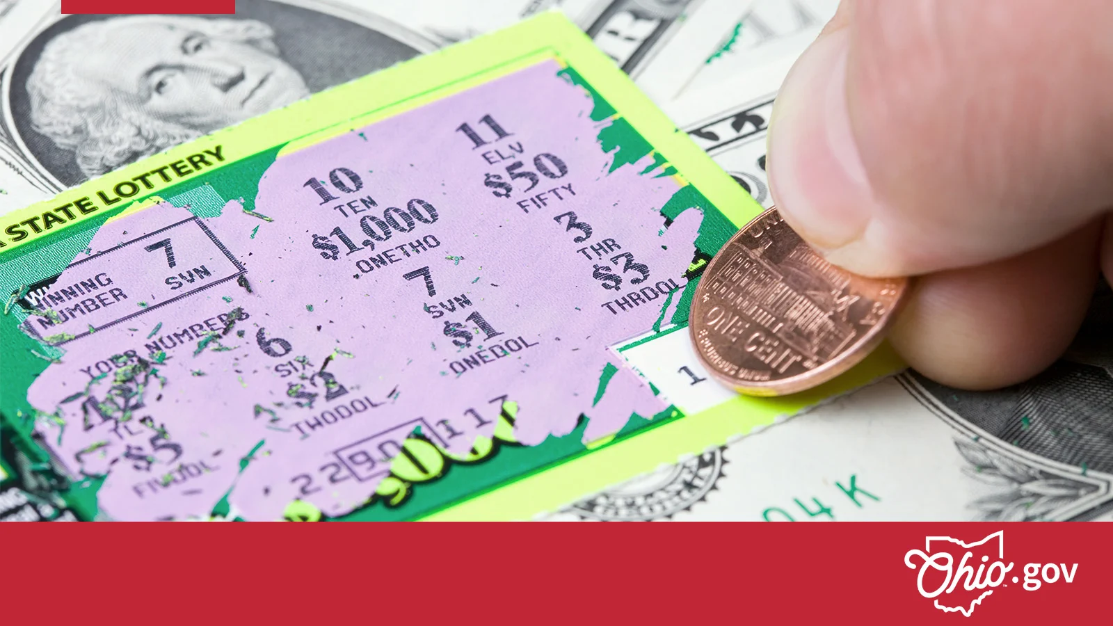 A person scratching off an instatn lottery card.