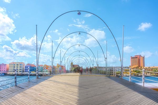 DebraMartz's tweet photo. "Queen Emma Pontoon Bridge Curacao"
Built in 1888 and named after a Dutch queen, this floating bridge connects the Punda and Otrobanda neighborhoods of Curacao's capital, Willemstad. 
 
https://t.co/LsWEWszuQF @DebraMartz #QueenEmma #bridge #curacao #willemstad #giftideas https://t.co/URjN7Ksghy