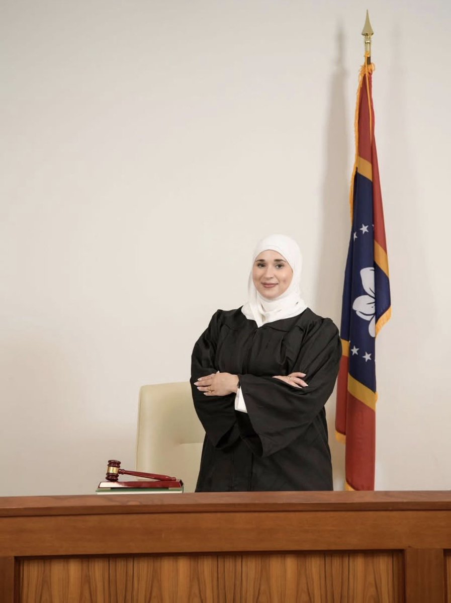 senmclendon's tweet photo. No AI. No Photoshop. Just newly appointed Hijabi-wearing Judge Assma Ali, proudly posing WITHOUT an AMERICAN FLAG.

Something is deeply wrong about this and she ought to be removed immediately, and the City of Benoit should lose its charter.

We are being invaded from within. 

@AmyMek