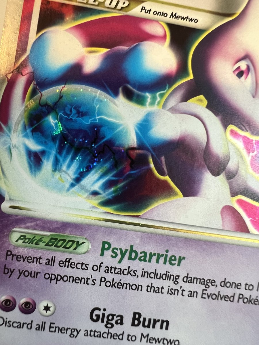 TheNorthWindTCG's tweet photo. I often like showing off my Mewtwo ex’s swirl but tell me why I have only just noticed that my childhood copy of Mewtwo Lv.X has it too. Not quite as cool bc the ball is massive, but these guys are living side by side from now on 🌀 https://t.co/IFTt4llVCN