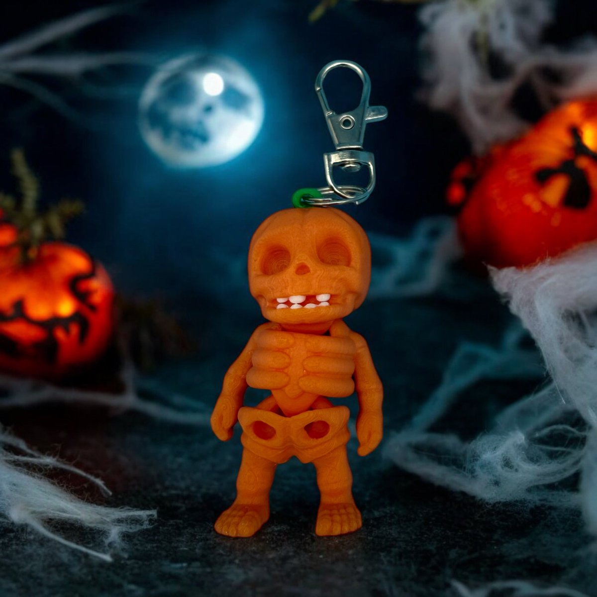 rd_3d_printing's tweet photo. Tiny Skeleton Pumpkin Bag Charm: a creepy-cute Halloween accessory with a grinning skull-like face and fall pumpkin shape. Clip it to keys, purses, backpacks, trick-or-treat bags, or zipper pulls. https://t.co/ykVvq8NDTj https://t.co/zafrjEa31C