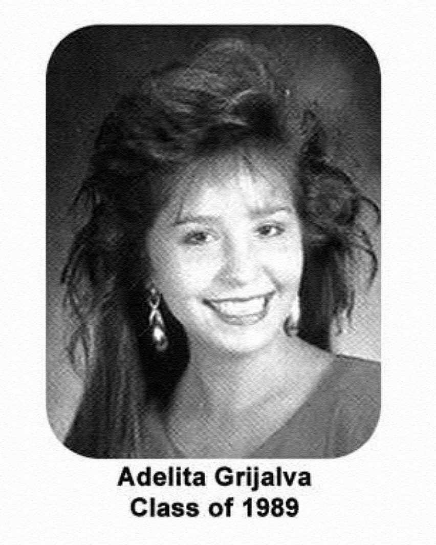 A black-and-white yearbook-style portrait of a smiling woman with voluminous hair and dangling earrings. Text identifying her and her graduating class appears beneath the portrait.