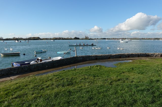 MabelReviewsGB's tweet photo. Bosham’s spring tide turned my pause into a regatta.

In Bosham, West Sussex, I only meant to sit for five minutes on Quay Meadow. Then a rowing crew slipped between moored boats and swans as water pressed through gaps in the harbour wall.

I followed the quay to the family-run Anchor Bleu, where bicycles leaned against the wall and the creek sat just beyond the pub. That small detour changed the place for me: meadow, quay and pub are not scenery. They let a village gather around its working water-and that everyday access deserves protecting.