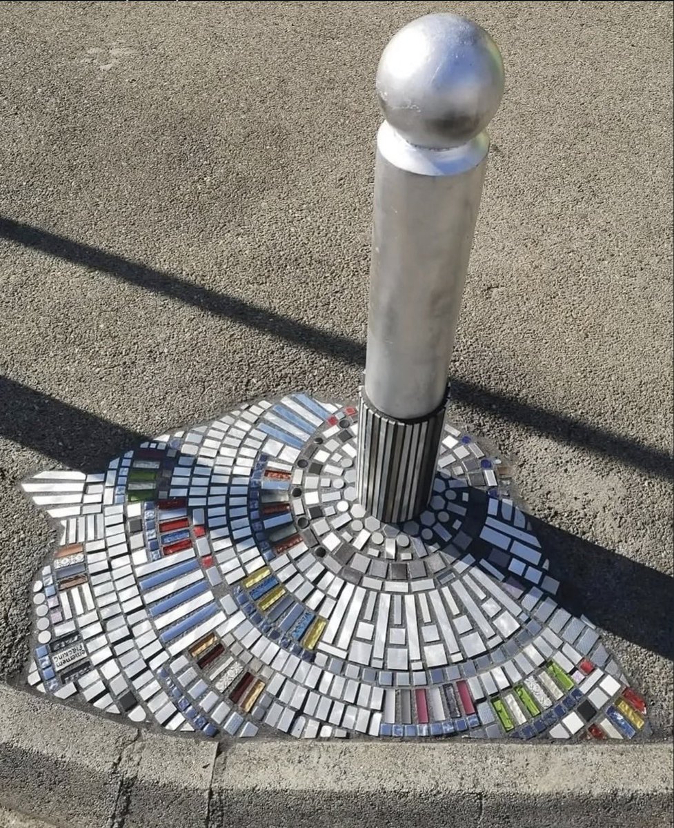 pmamtraveller's tweet photo. The street artist Ememem fills urban cracks, potholes, and broken sidewalks with colorful ceramic and tile mosaics. https://t.co/PCF5KCDPGs
