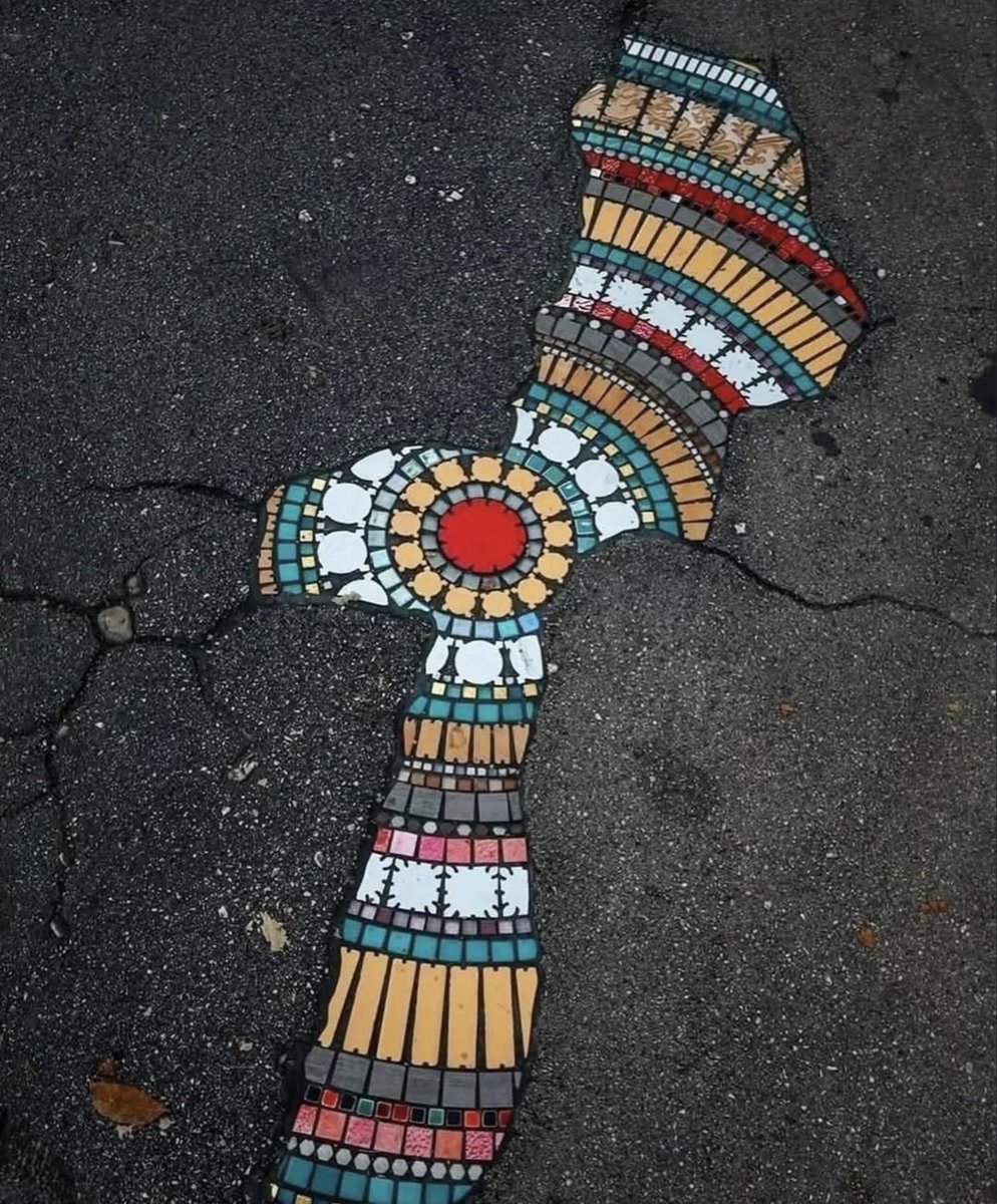 pmamtraveller's tweet photo. The street artist Ememem fills urban cracks, potholes, and broken sidewalks with colorful ceramic and tile mosaics. https://t.co/PCF5KCDPGs
