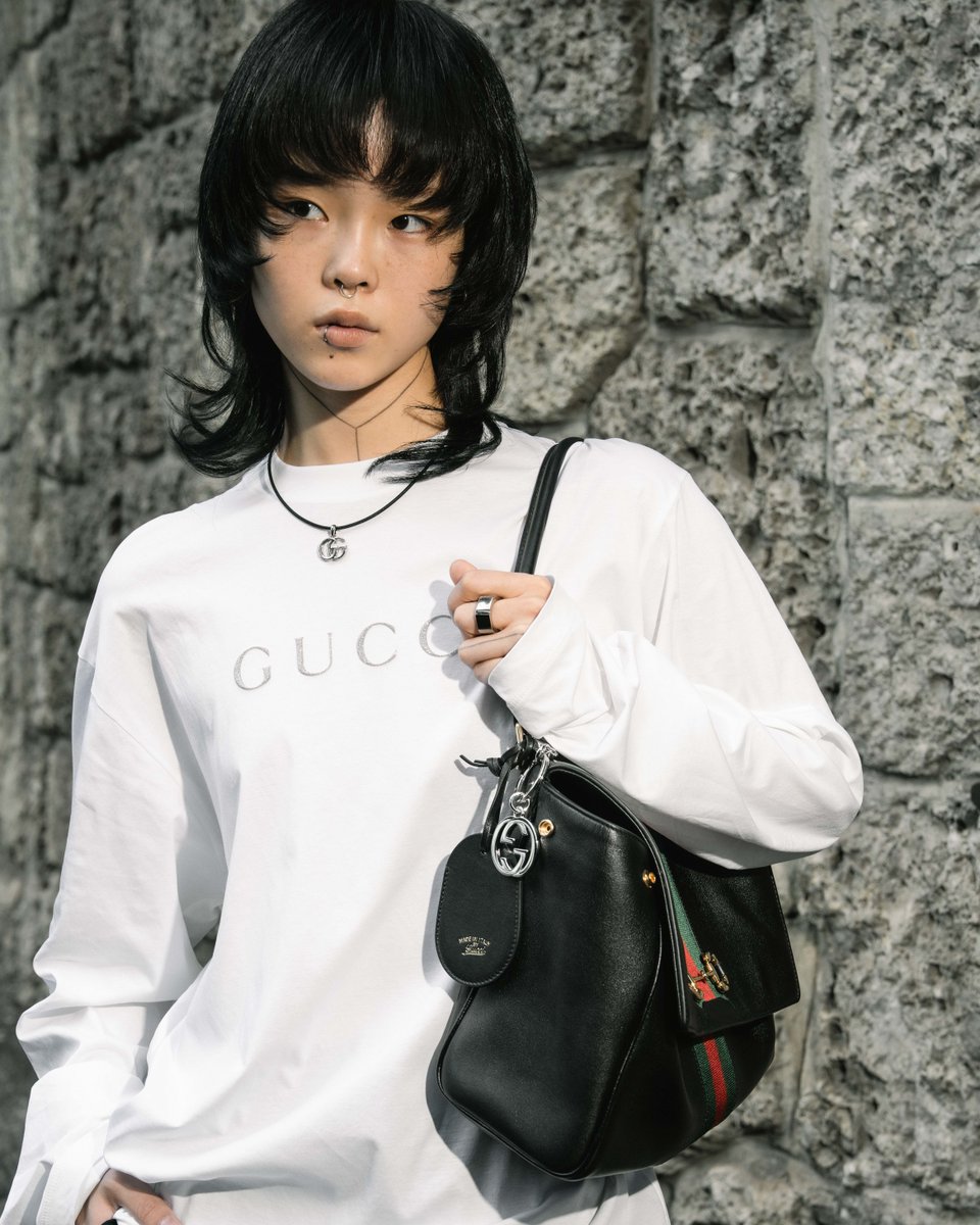 gucci's tweet photo. Ahead of #GucciTheStoreShow, Brand Ambassador #COCONA from @XGOfficial_ is seen with the #GucciPaparazzo. #MFW #XG https://t.co/0Y33TABC0I