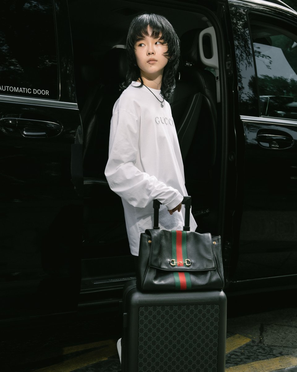 gucci's tweet photo. Ahead of #GucciTheStoreShow, Brand Ambassador #COCONA from @XGOfficial_ is seen with the #GucciPaparazzo. #MFW #XG https://t.co/0Y33TABC0I
