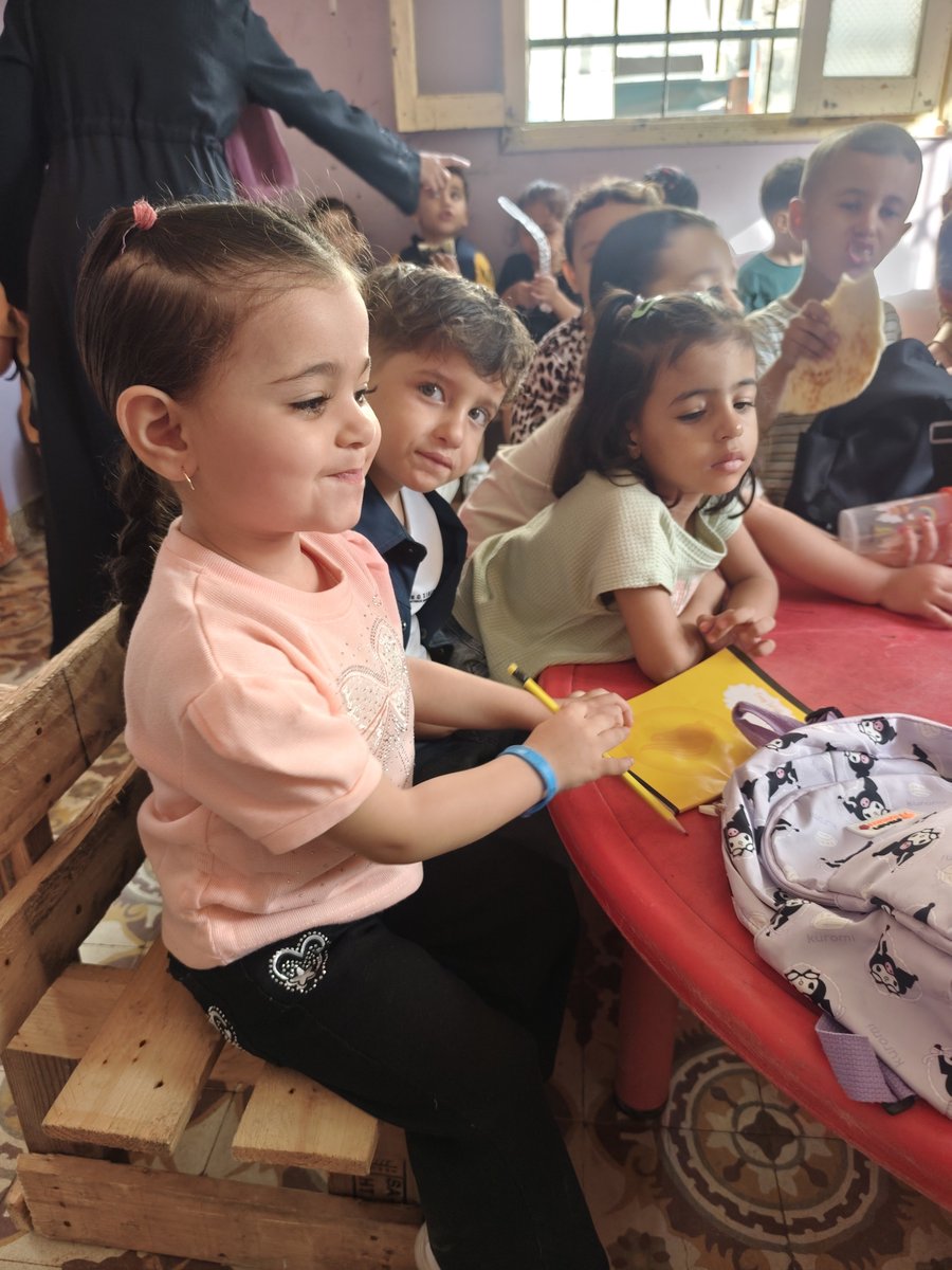 HaithamElmasri1's tweet photo. Kiraz has finished her first school day. ✅

The beginning of fulfilling a dream that was born in the heart of the brutal genocide, amid a reality that showed no mercy and left our children without even their most basic rights in life.

And yet, here she is, starting again…

Our children deserve a chance at life, not merely survival. They deserve to learn, to dream, and to grow up knowing what childhood means, not what war means. ❤️