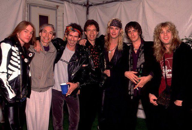 historyrock_'s tweet photo. Guns N' Roses opened for The Rolling Stones at four shows at the Los Angeles Memorial Coliseum in October 1989, as part of the "Steel Wheels Tour." 

Mick Jagger offered half a million dollars for the 4 nights, but GNR's manager, Alan Niven, negotiated the fee up to one million, a figure the Stones ultimately accepted.

That period was chaotic for the band, they hadn’t toured in months, and substance abuse, especially Axl Rose’s, complicated rehearsals. 

In fact, the first show nearly got canceled because Axl locked himself in his apartment minutes before going on stage. Despite the problems, the experience ended up serving as a bridge between generations of rock, and both bands would share the stage again years later, in 2006, during a European tour by the Stones.