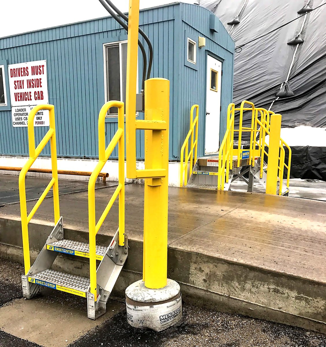 ErectaStep's tweet photo. Low truck-scale access still needs a defined route. ErectaStep installed a two-step stair unit at this food and beverage facility, with another bolted stair unit for the operator building. Ask ErectaStep about your access gap. #TruckScale #WorkplaceSafety https://t.co/M7lXdfBG5P
