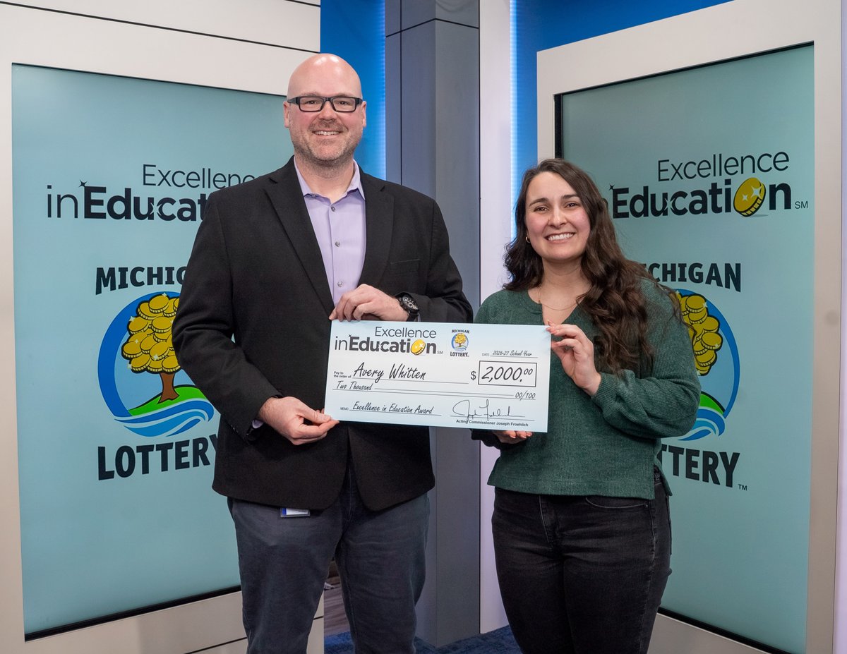 Lottery Spokesman, Jake Harris, presents Avery Whitten with her Excellence in Education check.