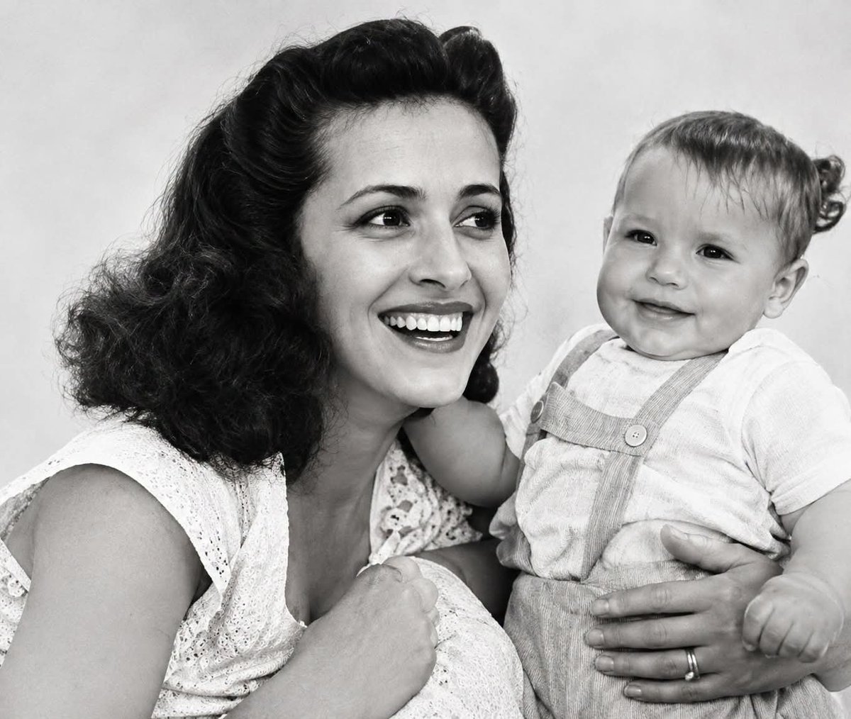 DOGEQEEN's tweet photo. She survived Auschwitz, raised a son alone in Queens, and never remarried. Her son would go on to become a rock star, but to him, she remained the strongest person he had ever known.

Flora Klein was born in Hungary in 1925. She was a Jewish girl growing up in a country that would eventually try to destroy her people. In 1944, when the Nazis finally invaded Hungary after years of an uneasy alliance, Flora was 19 years old. For a time, Hungarian Jews had been spared the fate that had already overtaken Jewish communities elsewhere in Europe. Then that protection disappeared almost overnight.

Flora and her family were rounded up, forced into cattle cars, and deported to Auschwitz-Birkenau, the extermination camp where more than 400,000 Hungarian Jews were murdered within a matter of months. Flora survived. One of her brothers, Larry, survived as well. Everyone else in her family, including her parents, siblings, aunts, uncles, and cousins, was killed in the gas chambers. Flora was only 19 when the world she knew was destroyed.

She would live another 74 years carrying the weight of what had happened.

After liberation in 1945, Flora spent years in displaced persons camps, places that became a kind of limbo for survivors who had nowhere to return to. Eventually, she married and became pregnant. In 1949, in Haifa, Israel, she gave birth to a son named Chaim Witz.

The marriage did not last. By 1958, Flora made the decision to leave for America. She went alone with her eight-year-old son. She spoke no English and had no money. All she had was her child and the same instinct to survive that had carried her through Auschwitz.

They first settled in Washington Heights and later moved to Queens. Flora found work in New York's garment factories, working long hours for little money and stitching clothes by the piece. She never remarried. Her son later explained that she had been deeply affected by the losses she had endured and had become fiercely protective of the small family she had left.

Flora rarely spoke about the camps. She didn't explain the nightmares, the silences, or why she saved every scrap of food and could never bring herself to throw things away. But she didn't have to explain everything. Her actions said enough.

From his mother, her son learned two lessons that would stay with him for the rest of his life: nothing is impossible, and survival means working harder than everyone else.

Those lessons helped build a rock star.

Chaim Witz would eventually become Gene Simmons, the bass player, co-founder, and fire-breathing face of KISS. The makeup, the outrageous performances, and eventually the global empire all grew alongside the work ethic Flora had instilled in him.

“Everything I am is because of my mother,” Gene has said. “She survived hell and still had the strength to raise me. Nothing I’ve done compares to what she survived.”

Flora lived long enough to see her son become famous and wealthy, but she never wanted the spotlight for herself. She had survived Auschwitz by learning how to remain unseen, and even after finding safety, she stayed private, quiet, and humble.

For decades, she refused to speak publicly about her past. But when she reached her 80s, she slowly began sharing her story. She gave testimony to Holocaust museums and allowed her experiences to be recorded for future generations. Gene said she did it because the survivors were growing older and dying, while Holocaust denial was becoming more common. She also wanted her grandchildren to understand where they came from.

After remaining silent for nearly sixty years, Flora Klein finally spoke because she didn't want the memory of her generation to disappear with it.

She died in December 2018 at the age of 93 in Los Angeles, surrounded by her family.

Her obituary identified her as Gene Simmons's mother. But that was only one part of her story.

Flora Klein was 19 when she entered Auschwitz. She should have died there. Instead, she survived.