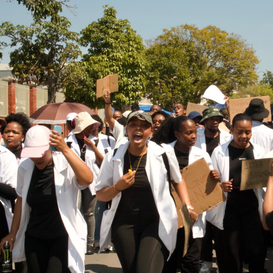 NPSM_Pharma's tweet photo. Pharmacy students from across the country took it to the streets of Pretoria, Grahamstown and Pietermaritzburg in response to the reduced number of internship posts. An internship mandated by the government and the pharmacy council. 
We demand answers now! 

#NDoHGiveUsPostsNow https://t.co/tCFDOBhqvy