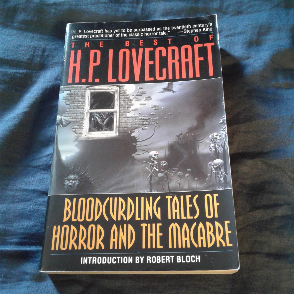 JamesGChampagne's tweet photo. Currently Reading: THE BEST OF H.P. LOVECRAFT by H.P. Lovecraft

This is a reread. In fact, this book (with its attractive wraparound cover art by Michael Whelan) is actually the very first Lovecraft collection I ever purchased, on September 12, 1999, at the Barnes & Noble bookstore in Bellingham, Massachusetts (this was some years before I started working there myself). It was my sophomore year at Rhode Island College, and I was transitioning into a Goth, and a website I discovered about Goth tastes mentioned how Lovecraft was a popular writer within that subculture, so I decided to give him a look (though I suppose the foundations had initially been laid by both the first GHOSTBUSTERS movie and also the animated GHOSTBUSTERS cartoon episode "The Collect Call of Cathulhu," though as a child the Lovecraftian references in such media went right over my head).

I've read numerous Lovecraft collections since, but it's been many years since I've read this one. For some reason when in my late teens/early-to-mid 20s I would sometimes read short story collections out of order (a bad habit I had shed by the time I hit my lates 20s/early 30s), so the first story I read in this one back in 1999 was actually the book's second tale, "The Picture in the House," thus making that the first Lovecraft story I ever read (and one reason why that story is always in my list of "Top Ten Favorite Lovecraft Stories"). I mostly agree with the selection of stories in this one: obviously THE CASE OF CHARLES DEXTER WARD and AT THE MOUNTAINS OF MADNESS would have been worthy inclusions, but as short novels were perhaps too long for a collection of this type. Having said that, I probably would have also added "Dagon," "The Festival," and "The Cats of Ulthar," but to each their own.