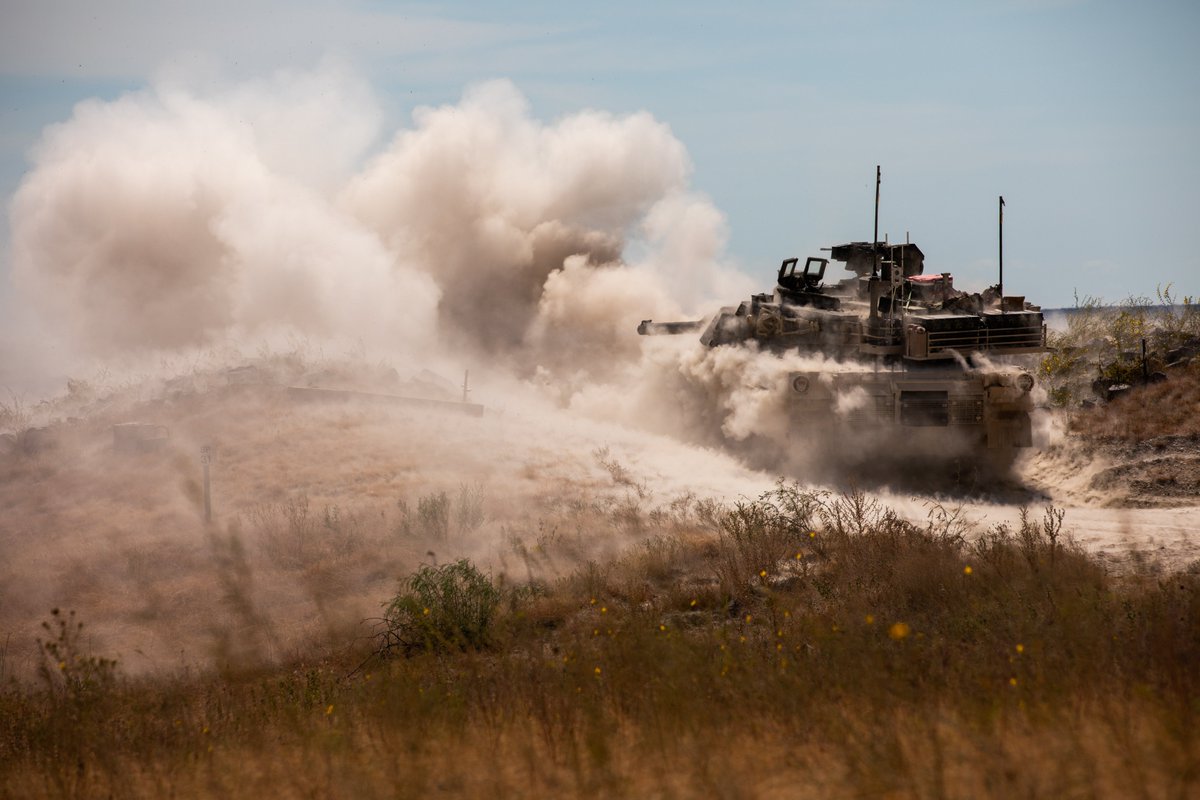 DeptofWar's tweet photo. Army tank crews fire M1A2 Abrams tanks in Fort Hood, Texas, putting crew coordination and weapons accuracy to the test during live-fire gunnery. https://t.co/yY1TGdb3IK