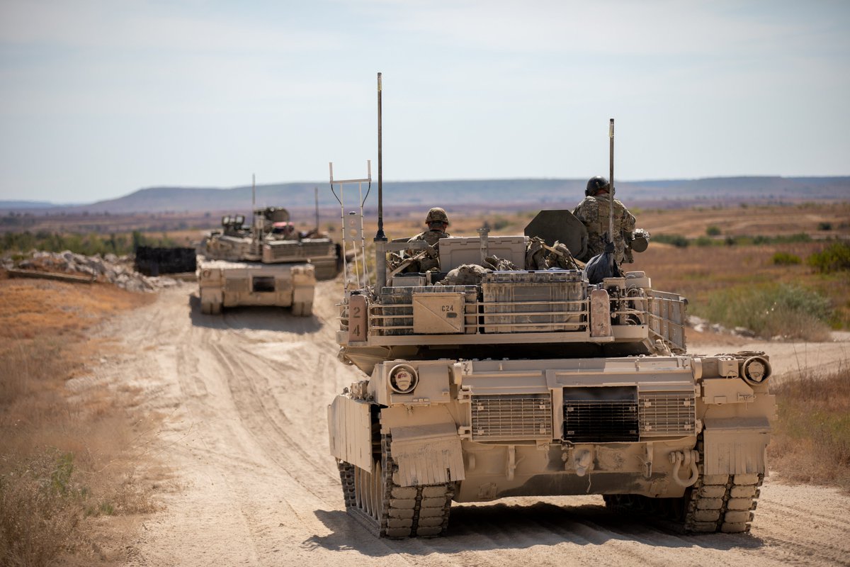 DeptofWar's tweet photo. Army tank crews fire M1A2 Abrams tanks in Fort Hood, Texas, putting crew coordination and weapons accuracy to the test during live-fire gunnery. https://t.co/yY1TGdb3IK
