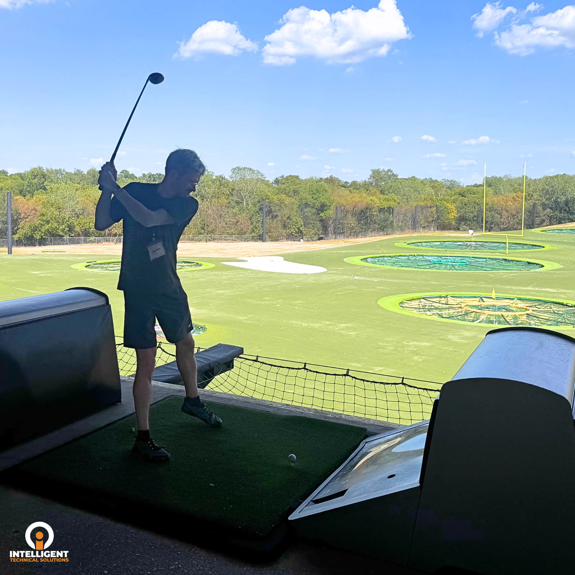 ITS team members and guests connect, play golf, and gather for a business networking event at Topgolf.