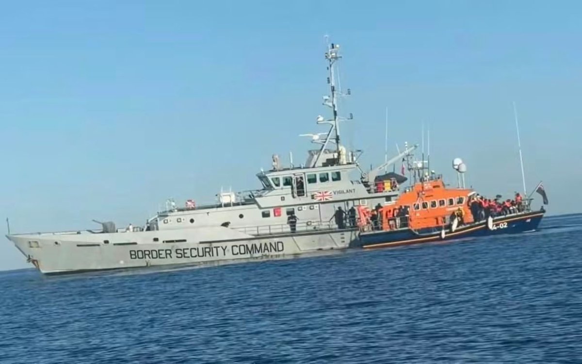 UK_Needs_Reform's tweet photo. The transfer of migrants is took place a couple hours ago, ready for transportation to shore.

Migrants being moved onto the RNLI taxi service.

Seriously,  is this a Mayday emergency or people smuggling? 

Re-post if you believe the RNLI are helping the smugglers and part of the process 🤔