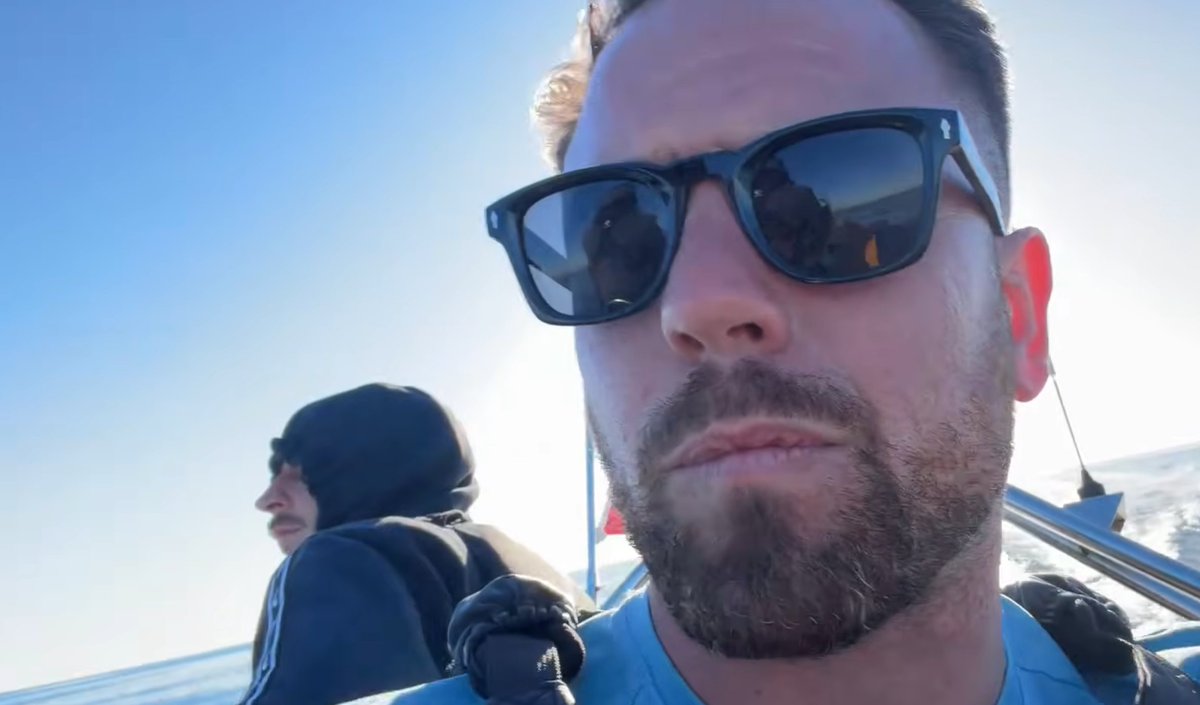 MittensOff's tweet photo. Danny Tommo had two shipmates helping him to put rescuers at risk in the Channel today. The skipper of the boat he was in (seen in grey), and a fake fisherman (with a massive nose). He thought he'd protected their identities, he hadn't. If you know who they are, alert the authorities.