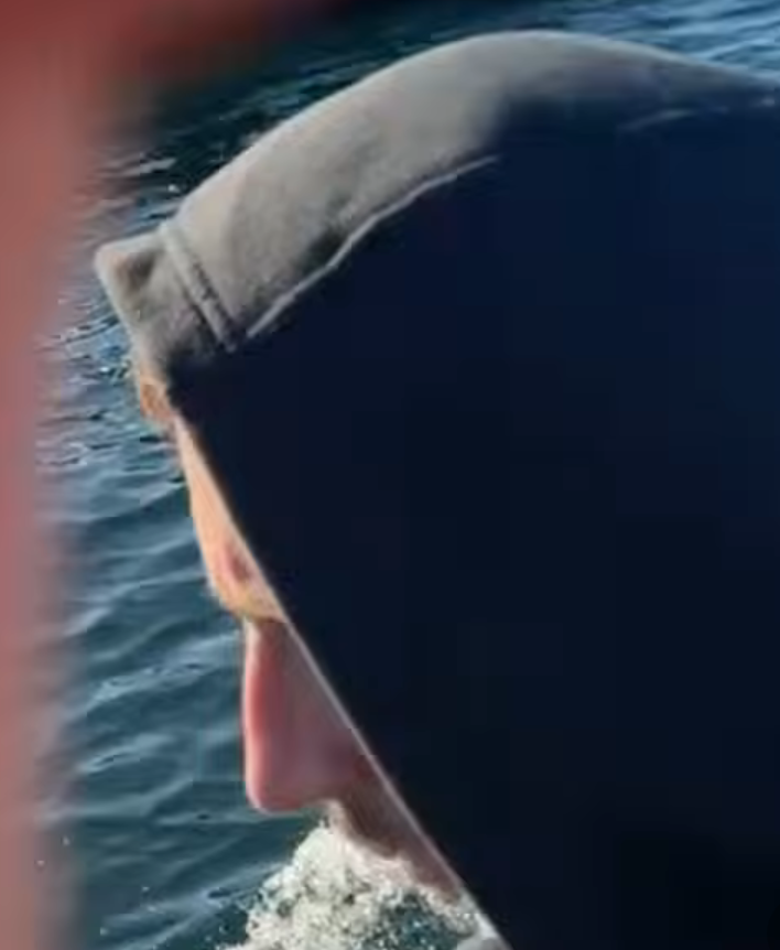 MittensOff's tweet photo. Danny Tommo had two shipmates helping him to put rescuers at risk in the Channel today. The skipper of the boat he was in (seen in grey), and a fake fisherman (with a massive nose). He thought he'd protected their identities, he hadn't. If you know who they are, alert the authorities.