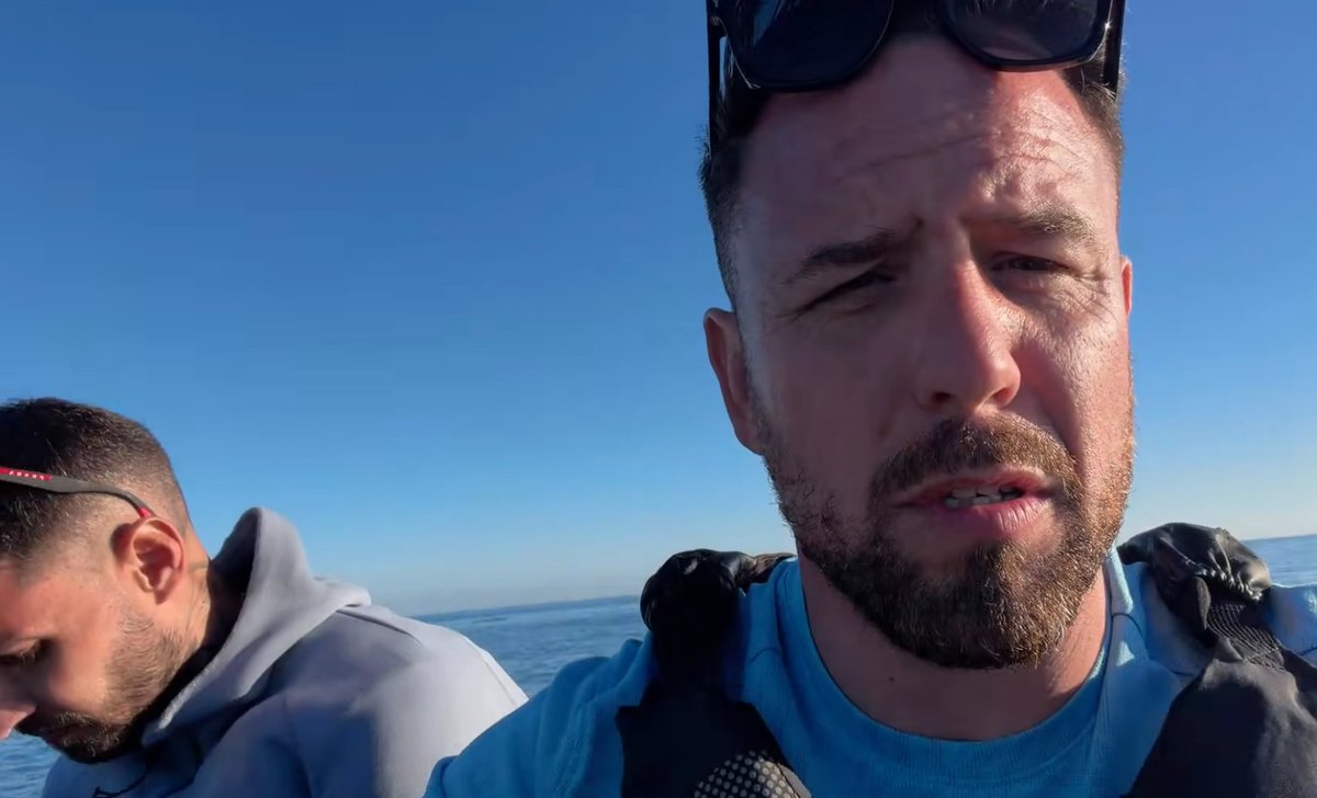 MittensOff's tweet photo. Danny Tommo had two shipmates helping him to put rescuers at risk in the Channel today. The skipper of the boat he was in (seen in grey), and a fake fisherman (with a massive nose). He thought he'd protected their identities, he hadn't. If you know who they are, alert the authorities.