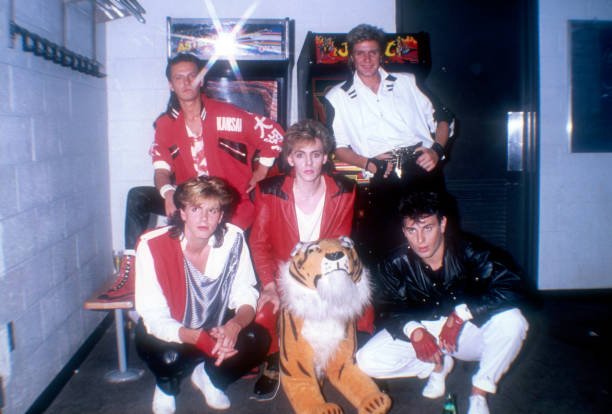 irisidol's tweet photo. We have one last photo as I made my research, from gettyimages. Here, Simon is smiling. Unfortunately it's in bad quality, but I still love it. https://t.co/dO6Oh85lNj