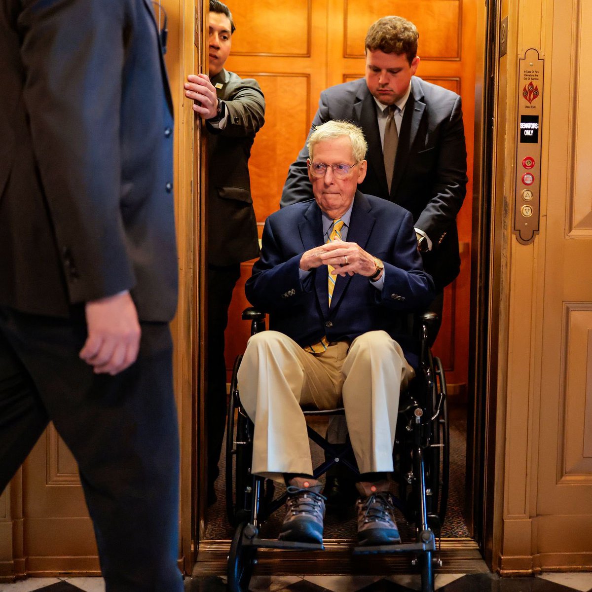 Milajoy's tweet photo. Mitch McConnell was wheeled into the Senate chamber where he initially voted with Democrats by mistake (He said NAY instead of YAY.). 

It's the only word he said. 

Then he was wheeled out and is MIA again. 

Congress needs yearly cognitive exams PRONTO. https://t.co/ppjSfDGeDx