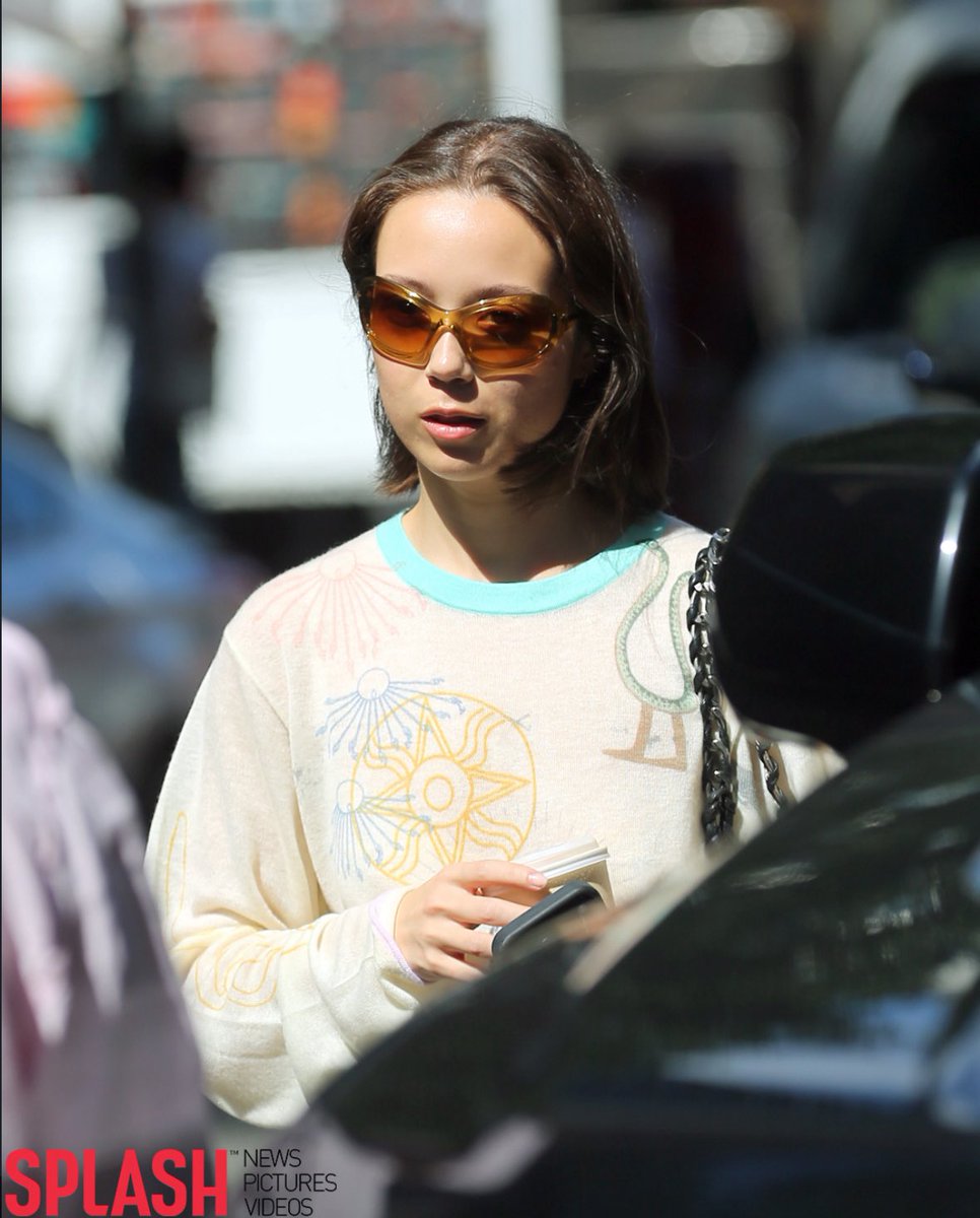 latenightxoshow's tweet photo. Laufey grabs coffee in NYC in a graphic sweater &amp; boots. https://t.co/1Bix8n8nwh