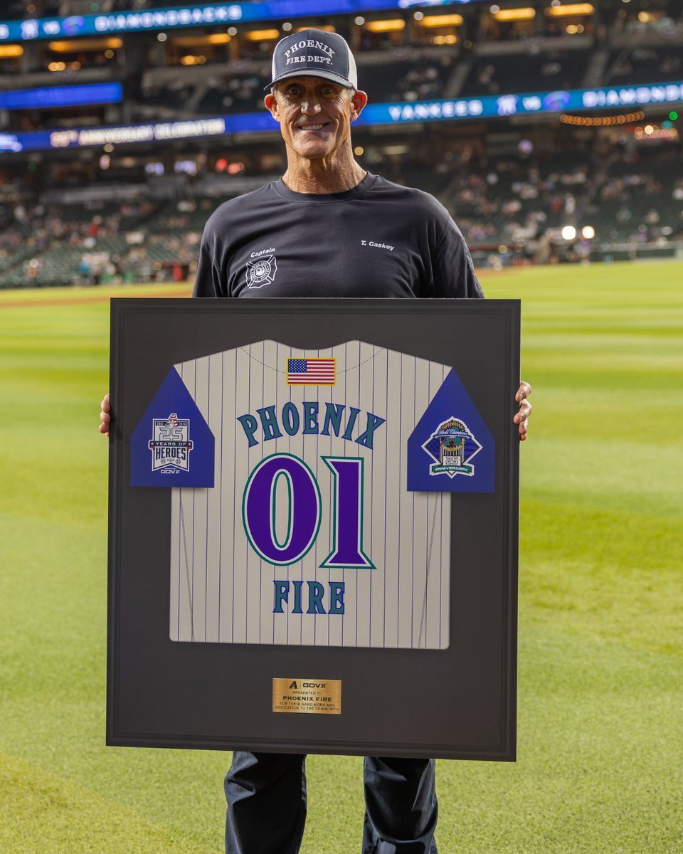 PHXFire's tweet photo. Before Friday night’s @dbacks vs. Yankees game, #PHXFire Captain Troy Caskey, took the field in a full-circle moment. Twenty-five years ago, he stood on that same field holding the American flag as the Yankees came to Arizona for the World Series. https://t.co/uNQQW0C1TA