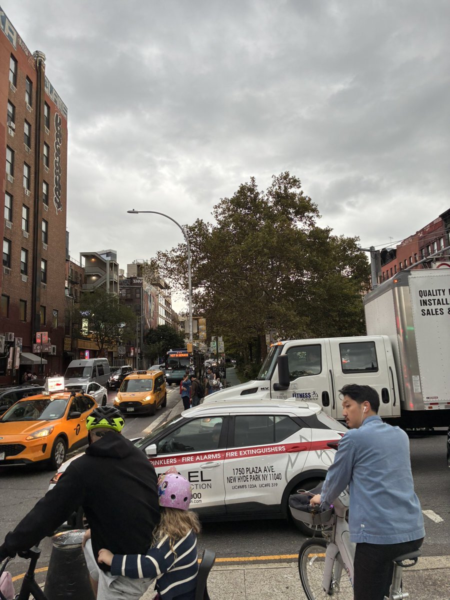 ccbaker2023's tweet photo. Delancey Street is a car-and-truck sewer where drivers constantly block the box, endangering pedestrians + bike riders, who are forced into traffic.

Pretty much every time the light changes, there are vehicles illegally blocking the intersection. Where are people supposed to go? https://t.co/BRyOqbdTeP