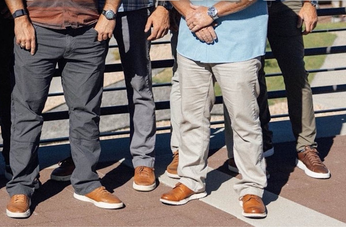 RealCandaceO's tweet photo. I haven’t been able to determine the shoe brand. But happy to provide a close up in case someone can identify them more accurately. 
It is of course possible they were all wearing matching shoes as a part of their plain clothes uniform. 
Butch choosing to wear the same style registers to me as quite a coincidence, though.