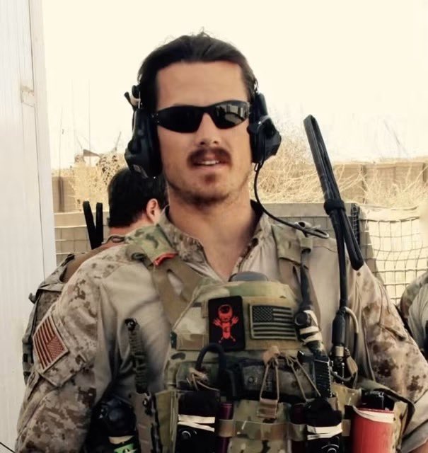 SpecOpsMagazine's tweet photo. Jonathan "MrBallen" Allen is the storyteller behind the popular "Strange, Dark and Mysterious" videos and the hit podcast that followed. Before the flannel and the campfire cadence, he was a U.S. Navy SEAL.

A Quincy, Massachusetts kid who dropped out of UMass Amherst after one semester before eventually returning and graduating with a philosophy degree in 2010, Allen enlisted right after college, and made it through one of the toughest pipelines in the military, graduating SEAL Qualification Class 291 in 2012. He served with SEAL Team Two from 2012 to 2017, deploying to Afghanistan in November 2013.

His service came with real cost. During a deployment on Easter Sunday 2014, his team took fire from Taliban fighters in a rooftop firefight in a small Afghan town, and in the chaos of their exit, ran into more enemy combatants. He was wounded by an enemy fragment grenade in the fighting, earning him the Purple Heart, alongside the Navy Commendation Medal with a Valor device.

After leaving the Navy, he co-founded Elite Meet, an organization helping veterans find employment, before launching his YouTube channel in 2020. Today he runs Ballen Studios and the MrBallen Foundation, which funds therapy, scholarships, and direct support for crime victims and their families, work he's said is shaped directly by his own firsthand understanding of trauma and loss.