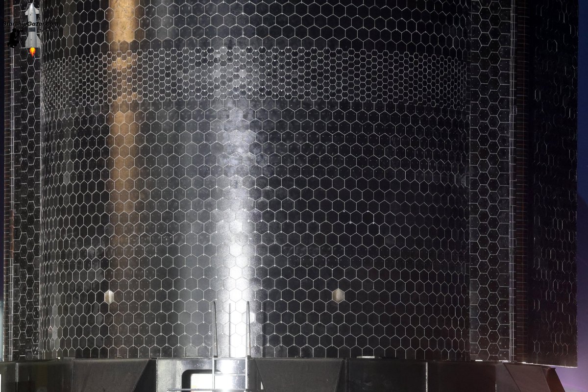 StarshipGazer's tweet photo. A look at the two reused Starship 40 heat shield tiles flying on Starship 41 during rollout to Starbase TX pad 2 tonight.

9/22/26 https://t.co/fRqQE8xgpQ