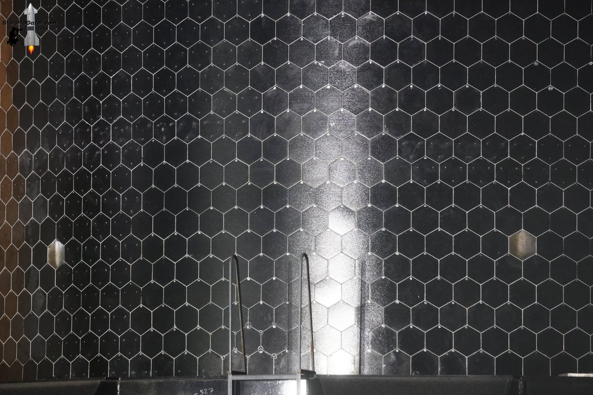 StarshipGazer's tweet photo. A look at the two reused Starship 40 heat shield tiles flying on Starship 41 during rollout to Starbase TX pad 2 tonight.

9/22/26 https://t.co/fRqQE8xgpQ