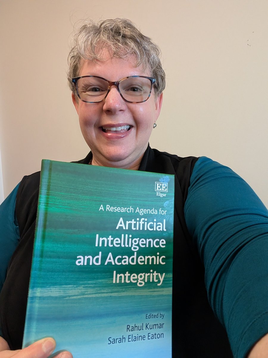 DrSarahEaton's tweet photo. When you arrive at work to find your new book in your mailbox...and realize the front cover accidentally matches your outfit. #AcademicIntegrity #ArtificialIntelligence https://t.co/raGprczjNt