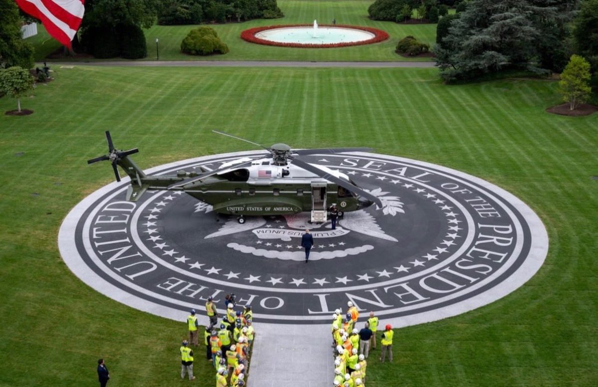 BoLoudon's tweet photo. For all of U.S. history, presidents stepping off Marine One had to walk across wet, muddy grass just to get home.

Presidents have always been photographed making the walk, which world leaders see.

Love Trump or not, It's embarrassing the White House didn't have this before. https://t.co/XCBWbyUirV