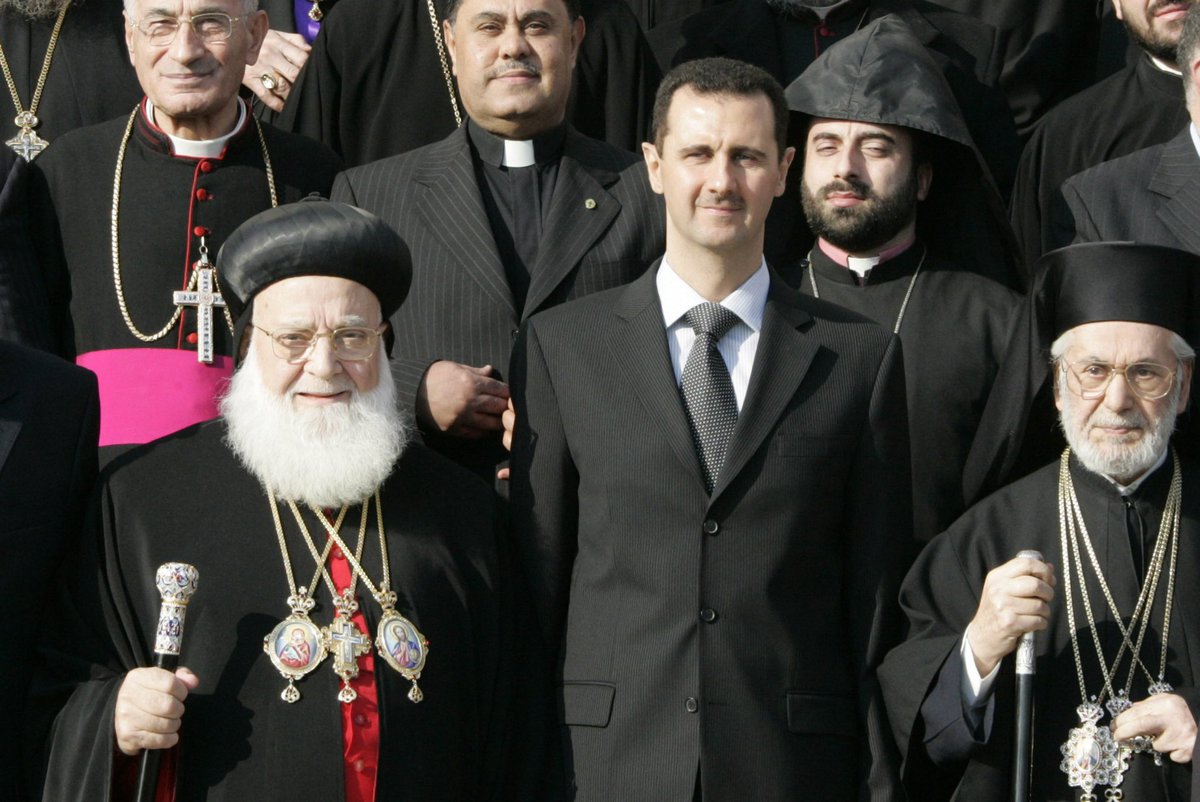socialistassad's tweet photo. Bashar al-Assad with Orthodox leaders, including Syriac Patriarch Ignatius Zakka I, during Christmas celebrations in Sednaya on December 25, 2007 https://t.co/3AuucztCWK