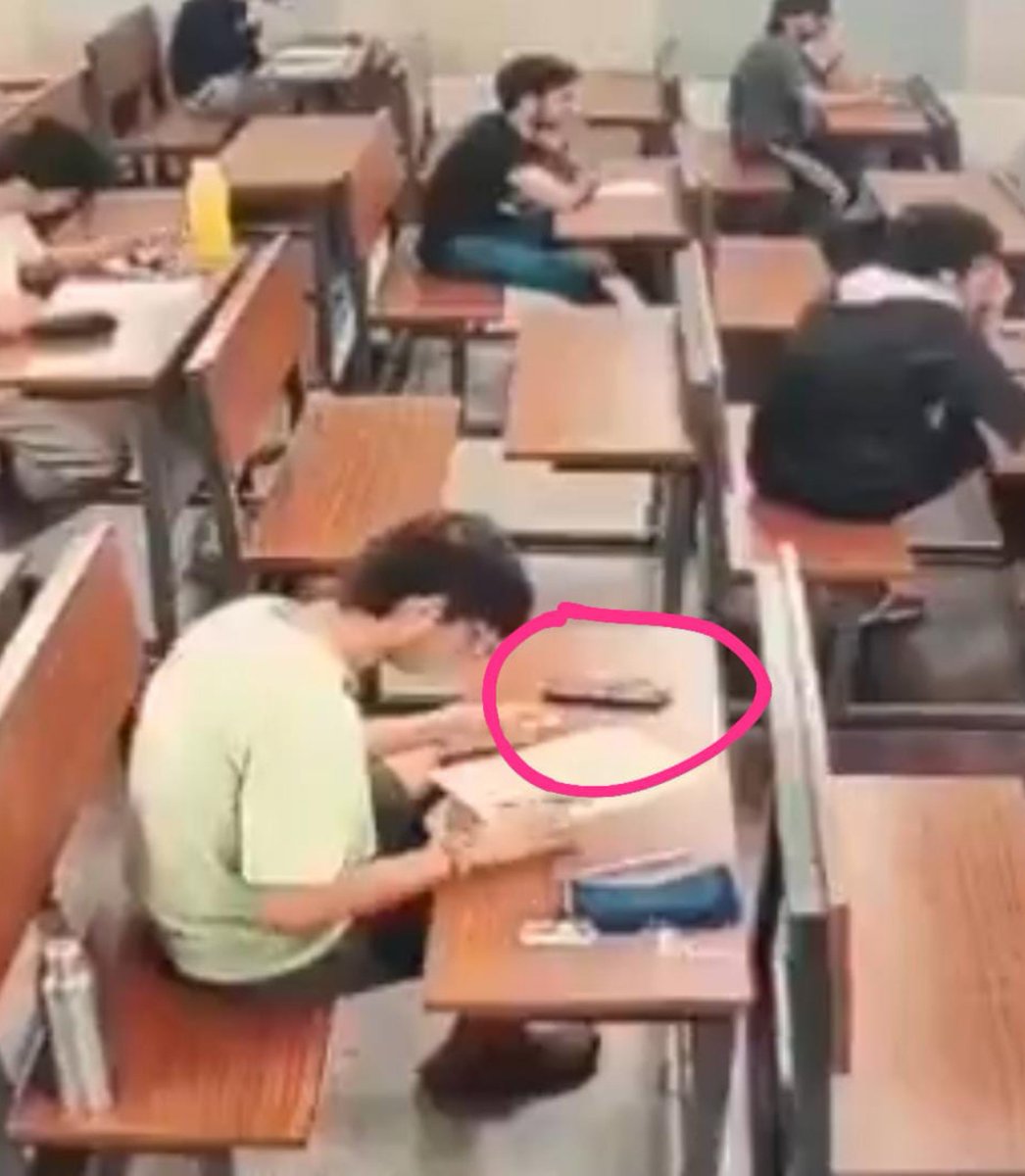 SurajKrBauddh's tweet photo. Listen, casteist monsters, 👹👿

You and your BJP-backed media lobby can't push us even an inch back from our firm stand through your CCTV misinformation agenda.

1) Who cheats while sitting on the first bench?

2) If Sahil Wakode was caught with a phone, why are other students seen keeping similar things on their benches? Use some logic. 

3) If IIT Bombay has already apologized over the cheating angle, why are caste Hindus and Manu Media still shamefully attacking the character of a deceased student?

4) It appears to be a calculator or box, and similar items can be seen on other students' benches too. It's allowed in exams.

5) The matter is already under investigation. How dare you run a vicious hate campaign against a student who is dead and cannot even defend himself from your vulture-media trial?

This is how cruel and inhuman caste prejudice can become when even a dead student is denied dignity and turned into a target of a social-media hate campaign.

We stand with Sahil Wakode's family and will continue demanding a free and fair investigation, accountability and justice, and we will challenge every misleading claim and misinformation campaign being pushed against him. You can't silence us through your caste hatred or paid agenda.