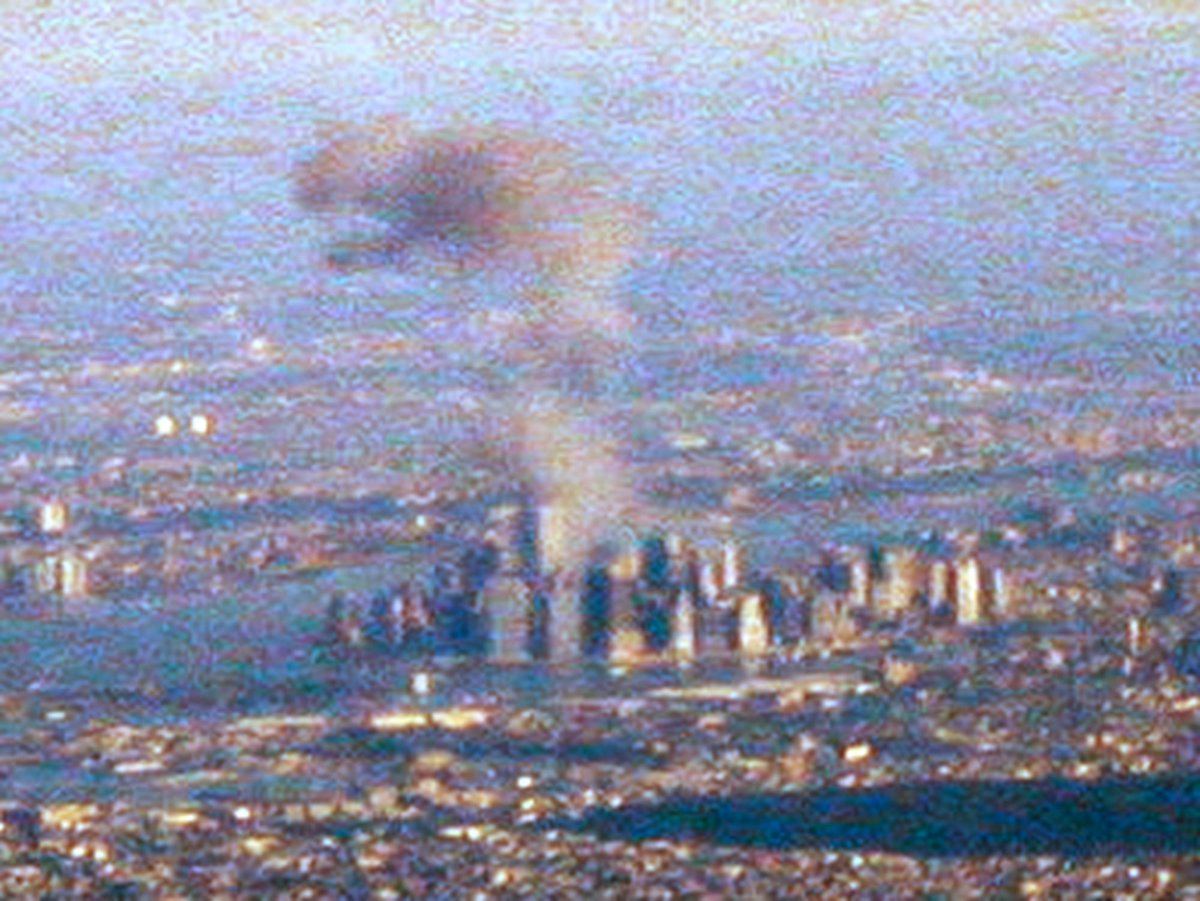 Sept11Archivist's tweet photo. New angle of what appears to be the fireball from American Airlines Flight 11 crashing into the North Tower. Photos by John Murphy https://t.co/W7SEpuxBZF