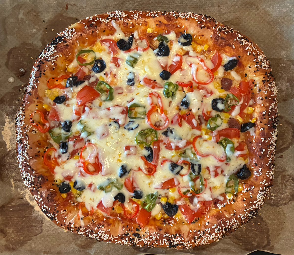 lyricandepic's tweet photo. Even Italians wouldn't have thought of a sesame crust... https://t.co/Wrq59fvv4o