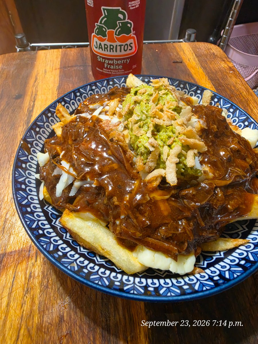 Raix43512345's tweet photo. @c4credit birria poutine with cheese cyrds and topped with cotija cheese, crispy onions and homemade guacamole with a strawberry jarritos https://t.co/c8XFV4Puoe