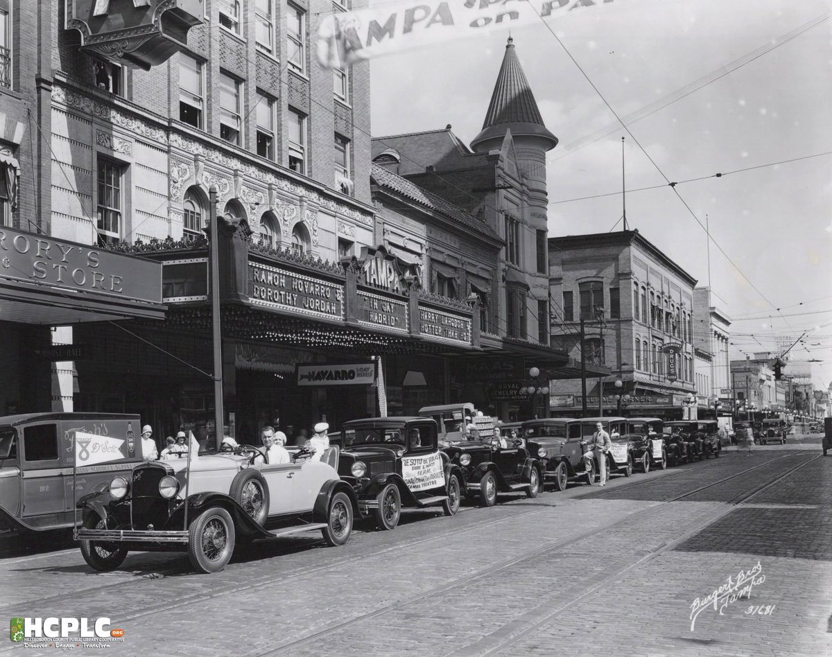 BeachFrmFL's tweet photo. DeSoto cars with movie advertising banners lined up on Franklin Street outside the Tampa Theatre, Tampa, #Florida - 1930 https://t.co/Cme5rFP048