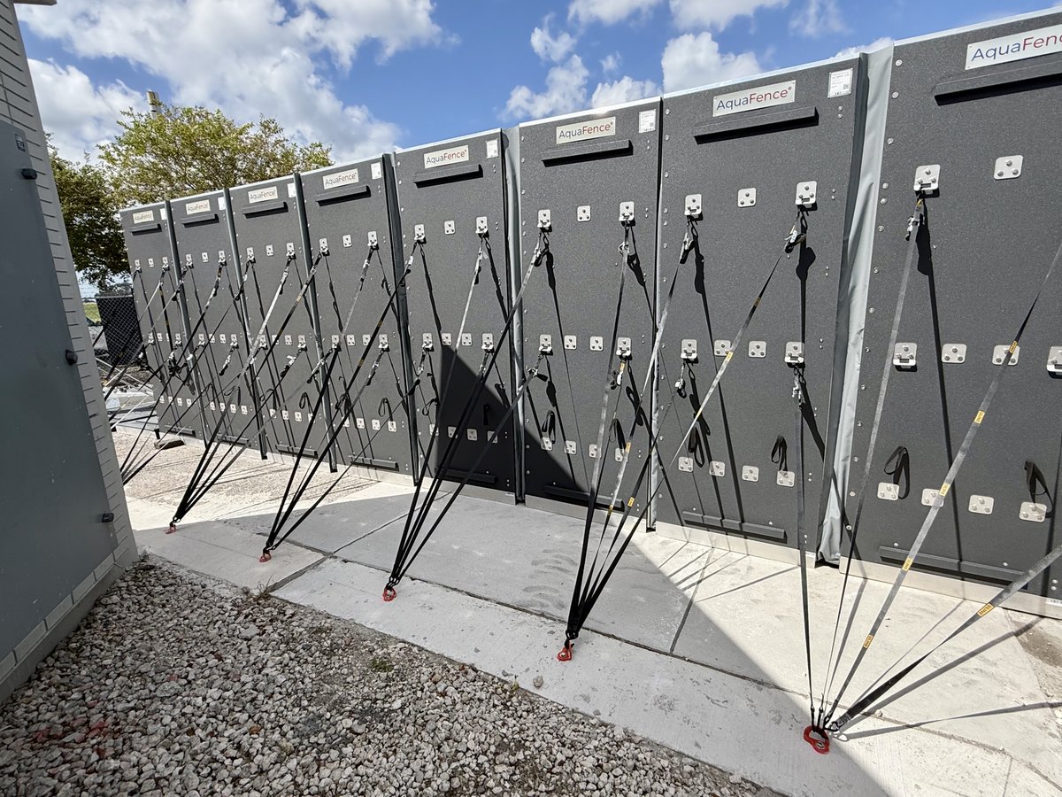 FlyTPA's tweet photo. PREPPING FOR THE FUTURE 🫡 Say hello to our new AquaFence, a temporary 9-foot barrier designed to shield TPA from storms. This new system was recently built to protect two electrical vault buildings should a hurricane threaten Tampa Bay. ⛈️

DETAILS: https://t.co/u5ItGGbGs3 https://t.co/eosbkfIyME